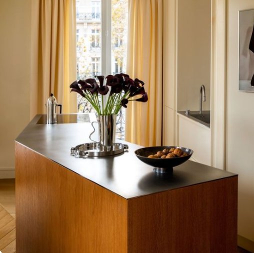 Stainless steel kitchen island with warm wood base